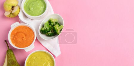 Photo for Vegetable and fruit baby puree in white bowls with ingredients on a pink background. Baby food concept. Top view. Panorama with copy space. - Royalty Free Image