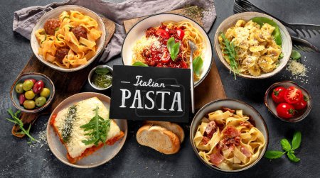 Photo for Pasta. Assortment of Italian pasta dishes, including spaghetti Bolognese, penne, tortellini, ravioli and others on a black background. Top view. - Royalty Free Image