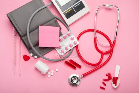 Photo for Stethoscope, medicine, tubs on pink background. Medical stuff. Top view. - Royalty Free Image