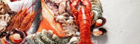Photo for Assortment of fresh raw fish and seafood. Healthy and balanced diet or cooking concept. Top view. Panorama with copy space. - Royalty Free Image
