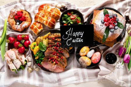 Photo for Cheerful Easter table. Traditional food at the event. Holiday concept. Top view - Royalty Free Image