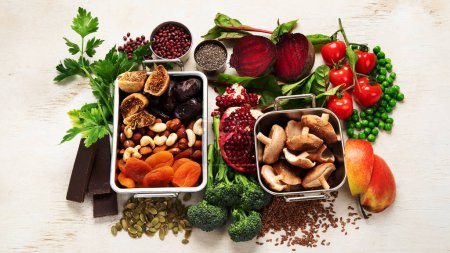 Photo for Vegan food rich of iron. Healthy eating. Vegetables, fruits and nuts. Top view - Royalty Free Image