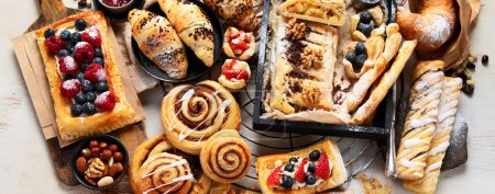 Photo for Sweet pastries on a light background. Top view, banner - Royalty Free Image
