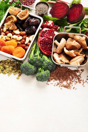 Photo for Vegan food rich of iron. Healthy eating. Vegetables, fruits and nuts. Copy space - Royalty Free Image