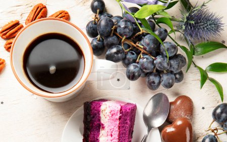 Photo for Holiday cake with cup of coffee and grape on light wooden background. Top view - Royalty Free Image