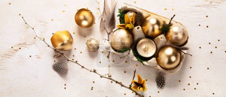 Photo for Stylish golden eggs easter concept. Easter gold eggs with flowers on light background. Happy easter card. Top view. Panorama. - Royalty Free Image
