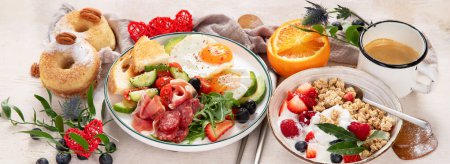 Photo for Healthy breakfast with oatmeal, berries, egg, bacon and a cup of coffee. Good morning. Banner - Royalty Free Image