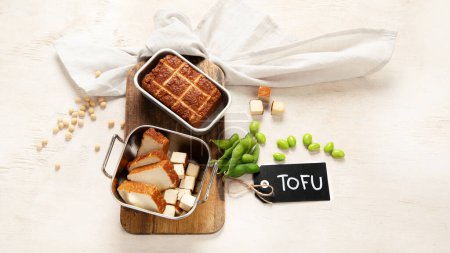 Photo for Soy food. Baked tofu cheese on a board, soybeans. Vegan product. Copy space - Royalty Free Image