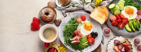 Photo for Breakfast served with coffee, fresh bakery, eggs, salad, meat and fruits. Holiday concept. Top view. Panorama with copy space. - Royalty Free Image