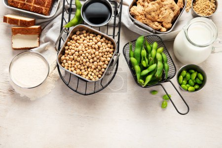Photo for Various soy products with soy bean, tofu, soy sauce and soy milk on a light background. Top view. Copy space. - Royalty Free Image