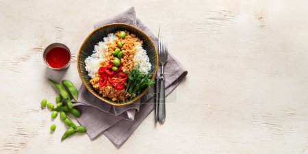 Photo for Vegan food. Soy meat, white rice, beans, red pepper on light wooden background. Top view, copy space, banner - Royalty Free Image