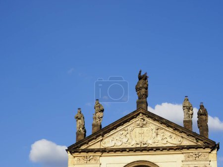 Prague, Czech Republic - May 10, 2024: Roof of the Church of the Holy Savior - Roman Catholic church in the Clementinum, in the Old Town against the blue sky, view from Charles Bridge