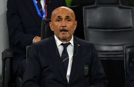Photo for Milan, Italy - September 11, 2023: Italian manager Luciano Spalletti seats on a bench during the UEFA EURO 2024 Qualifying game Italy v Ukraine at Stadio San Siro in Milan, Italy - Royalty Free Image