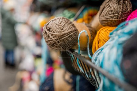 Photo for Wool craft yarn with different colors of threads for knitting at street market. Craft hobby shopping store with variation of handicraft products - Royalty Free Image