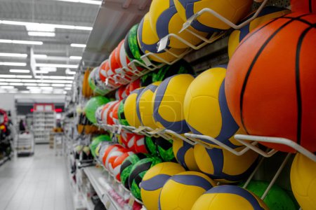 Photo for Supermarket Aisles Brim With Goods, Including Rows Of Balls - Royalty Free Image