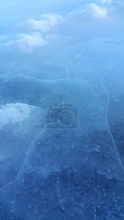 Photo for Brittle ice on the surface of a frozen river, close-up natural winter background - Royalty Free Image