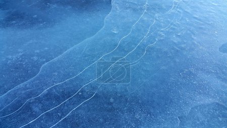 Photo for Natural ice texture, winter background, brittle ice on the surface of a frozen river - Royalty Free Image