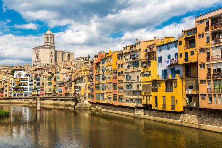 Photo for Colorful houses and Saint Mary Cathedral at background in Girona, in a beautiful summer day, Catalonia, Spain - Royalty Free Image