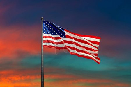 Photo for USA flag waving against sunset sky with beautiful cloud - Royalty Free Image