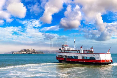 Photo for Ferry ship against Alcatraz prison Island in San Francisco, California, USA - Royalty Free Image