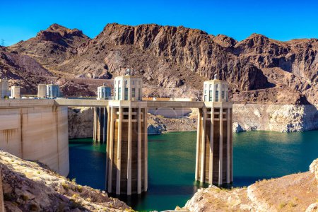 Photo for Hoover Dam and penstock towers in Colorado river at Nevada and Arizona border, USA - Royalty Free Image