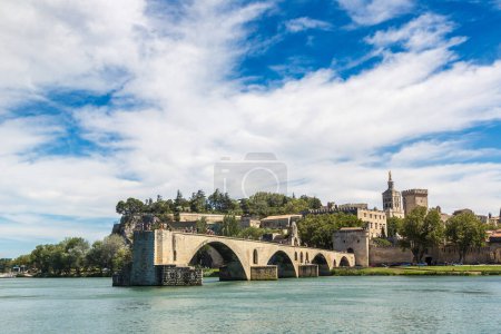Photo for Saint Benezet bridge and Palace of the Popes in Avignon in a beautiful summer day, France - Royalty Free Image