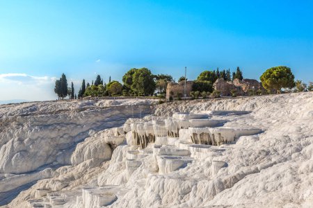 Photo for Travertine pools and terraces in Pamukkale, Turkey in a beautiful summer day - Royalty Free Image