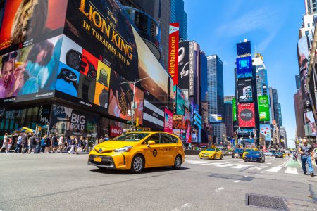 Photo for NEW YORK CITY, USA - MARCH 15, 2020: Yellow taxi on Times Square is a symbol of New York City, USA - Royalty Free Image