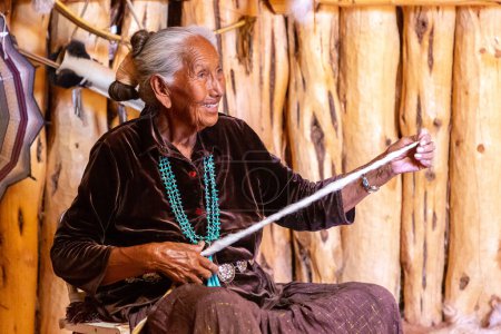 Photo for ARIZONA, USA - MARCH 29, 2020: Old Navajo woman in Navajo nation reservation at Monument Valley, Arizona, USA - Royalty Free Image