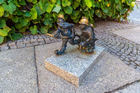 Photo for WROCLAW, POLAND - SEPTEMBER 21, 2022: Symbol of Wroclaw - Sculpture of dwarf (gnome) from fairy-tale in a sunny day, Wroclaw, Poland - Royalty Free Image