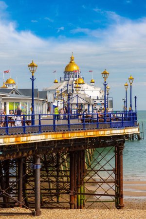Photo for EASTBOURNE, UK - JUNE 29, 2022: Eastbourne pier and beach in a sunny summer day, East Sussex, England, UK - Royalty Free Image
