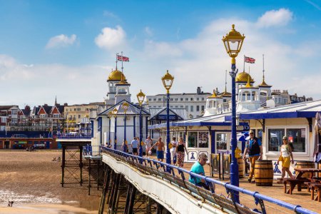 Photo for EASTBOURNE, UK - JUNE 29, 2022: Eastbourne pier and beach in a sunny summer day, East Sussex, England, UK - Royalty Free Image