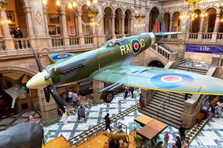 Photo for GLASGOW, UK - JUNE 14, 2022: Interior of the Kelvingrove Art Gallery and Museum with a Spitfire plane in Glasgow, Scotland, UK - Royalty Free Image