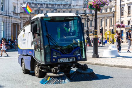 Photo for LONDON, UK - JUNE 17, 2022: Street cleaning vehicle working on a street in London in a sunny summer day, UK - Royalty Free Image