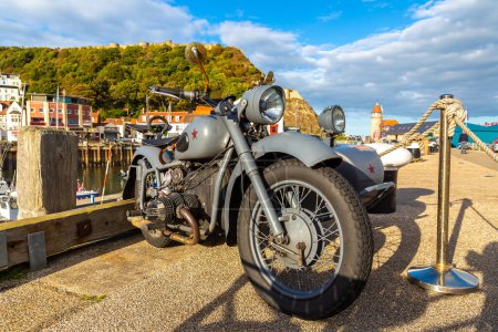 Photo for SCARBOROUGH, UK - JULY 27, 2022: Old Retro Motorcycle with sidecar in Scarborough, Yorkshire in a sunny summer day, UK - Royalty Free Image