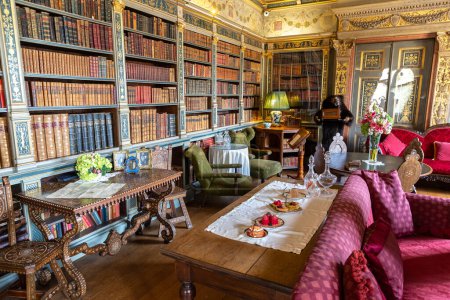 Photo for WARWICK, UK - JUNE 11, 2022: Vintage library and Interior of Warwick Castle - is a medieval castle built by William the Conqueror in 1068, UK - Royalty Free Image