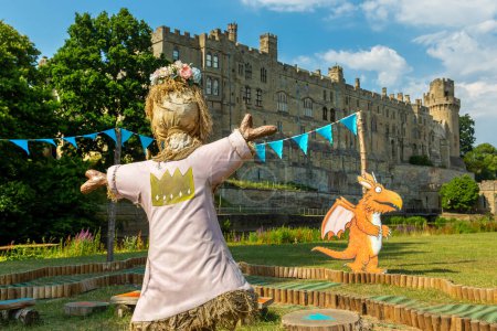 Photo for WARWICK, UK - JUNE 11, 2022: Scarecrow in Warwick Castle - is a medieval castle built by William the Conqueror in 1068 in a sunny summer day, UK - Royalty Free Image