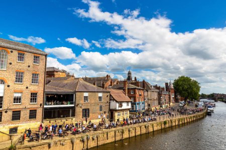 Photo for YORK, UK - JUNE 10, 2022: Embankment and river Ouse in York in a sunny summer day, North Yorkshire, UK - Royalty Free Image