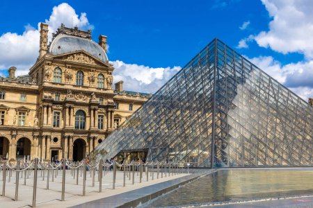 Photo for PARIS, FRANCE - JUNE 01, 2022: The Louvre and Pyramid - is one of the world's largest museums in Paris in a summer day, France - Royalty Free Image