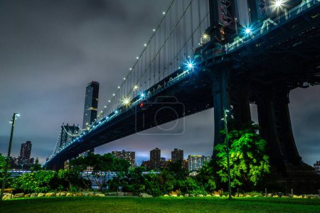 Photo for Manhattan Bridge and panoramic night view of downtown Manhattan after sunset in New York City, USA - Royalty Free Image