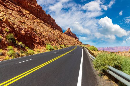 Photo for Scenic road through red cliffs in a sunny day, USA - Royalty Free Image