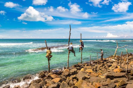 Photo for Local Fisherman fishing in traditional way at the beach in Sri Lanka - Royalty Free Image