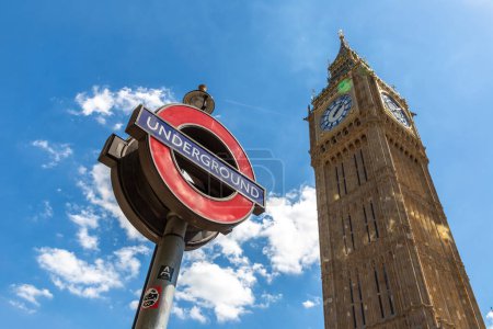Photo for LONDON, UK - JUNE 17, 2022: Big Ben and London underground sign outdoor in a sunny summer day in London, UK - Royalty Free Image