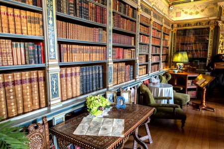 Photo for WARWICK, UK - JUNE 11, 2022: Vintage library and Interior of Warwick Castle - is a medieval castle built by William the Conqueror in 1068, UK - Royalty Free Image