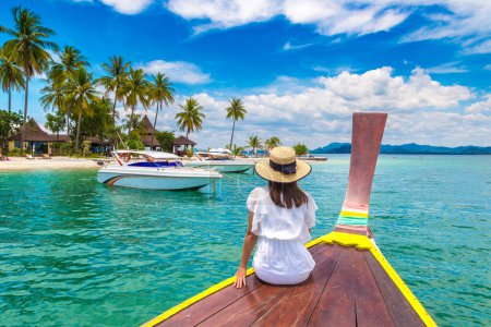 Photo for Happy traveler woman relaxing on boat near tropical island in Thailand - Royalty Free Image