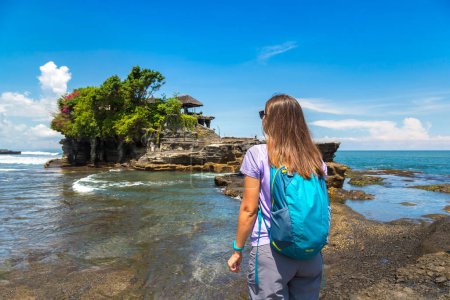 Photo for Woman traveler at  Tanah Lot temple on Bali, Indonesia in a sunny day - Royalty Free Image
