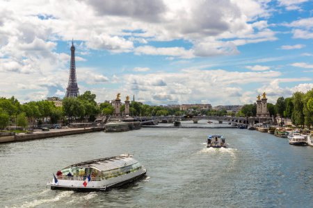 Photo for Eiffel tower and river cruise boat on Seine river in Paris in a sunny summer day, France - Royalty Free Image
