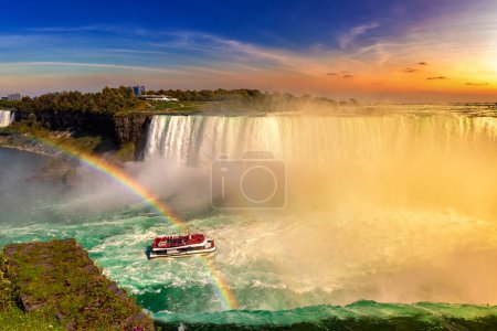 Photo for Canadian side view of Niagara Falls, Horseshoe Falls and boat tour at sunset  in Niagara Falls, Ontario, Canada - Royalty Free Image