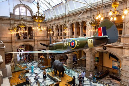 Photo for GLASGOW, UK - JUNE 14, 2022: Interior of the Kelvingrove Art Gallery and Museum with a Spitfire plane in Glasgow, Scotland, UK - Royalty Free Image