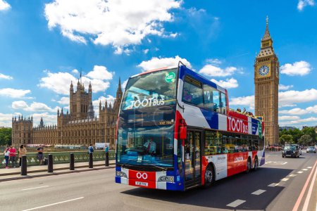 Photo for LONDON, THE UNITED KINGDOM - JUNE 26, 2022: Open-top Hop-on Hop-off Bus - TOOTBUS on the Westminster Bridge and Big Ben and Palace of Westminster  in London, England, UK - Royalty Free Image